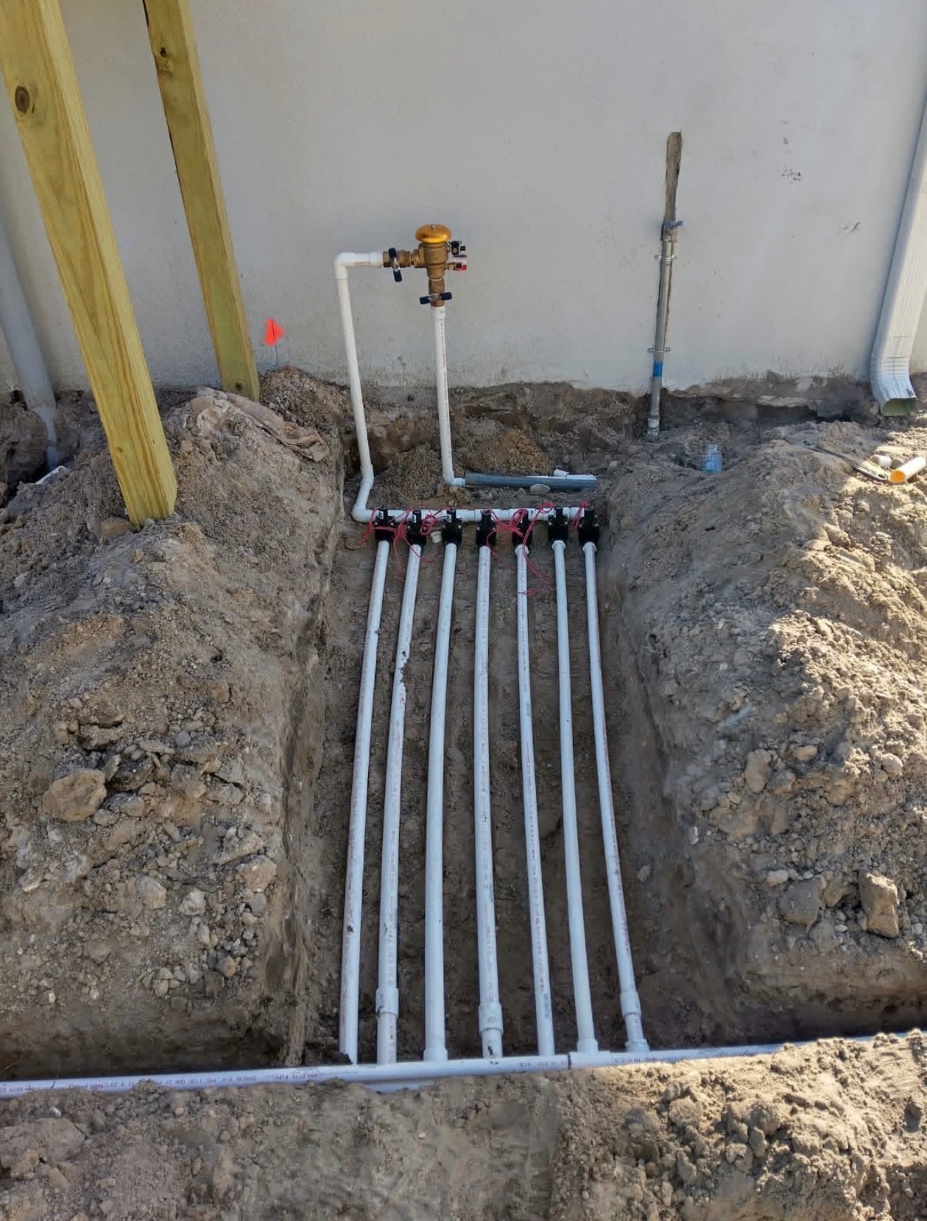 Professionally installed irrigation manifold with multiple zones